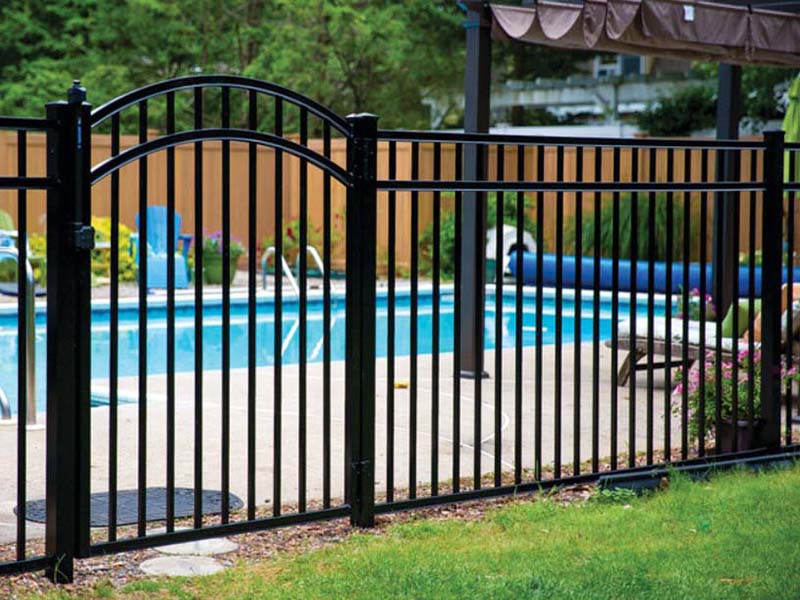 Black aluminum pool fence with arched gate in Metheun Massachusetts